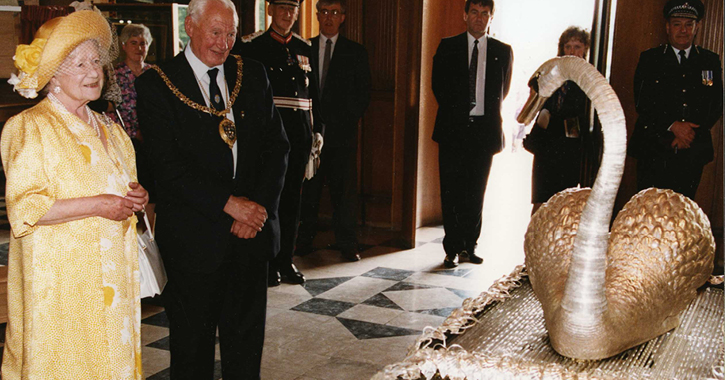 The Queen Mother on a past visit to the Bowes Museum admiring the famous Silver Swan.